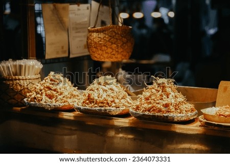 Fried crab with price tag on display at Dongmun Market in Jeju Island, South Korea. Royalty-Free Stock Photo #2364073331