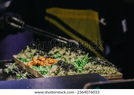 One of the delicious street food dish at the Dongmun Night Market.This is one of Jeju famous tourist spot. Royalty-Free Stock Photo #2364076033