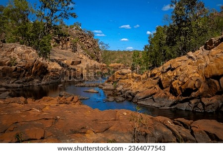 Forest stream among the stones. RIver rocks. Rocky river flowing. River in red rocks Royalty-Free Stock Photo #2364077543