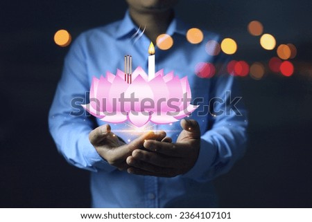 Thailand Loy Krathong Festival concept. Man holding pink lotus flower bowl made with digital graphic to reduce pollution and not create trash to promote the festival and zero waste.