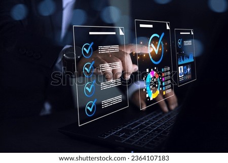 Audit approval standards compliance concept. Businessman pointing check mark on laptop screen to approve document assessment on ISO quality assurance standard law regulation requirement to be done. Royalty-Free Stock Photo #2364107183