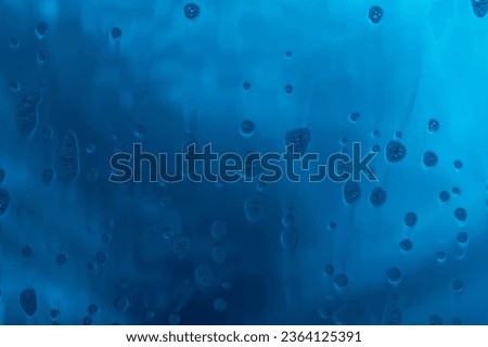 Blue texture with natural soap foam pattern on glass Royalty-Free Stock Photo #2364125391