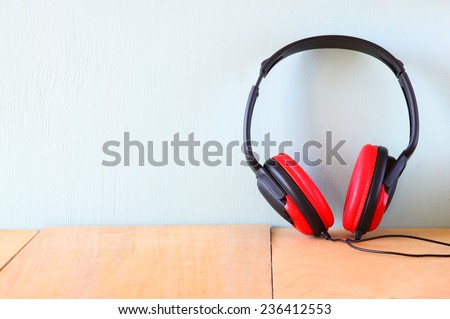 vintage headphones over wooden table
