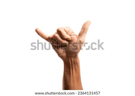 Black male hand doing surf gesture with hand isolated no background Royalty-Free Stock Photo #2364131457