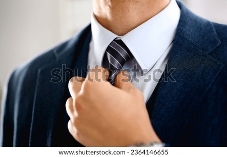 Male arm in blue suit set tie closeup. White collar management job serious move secretary student luxury formal interview executive agent marriage store corporate elegance employment preparation Royalty-Free Stock Photo #2364146655
