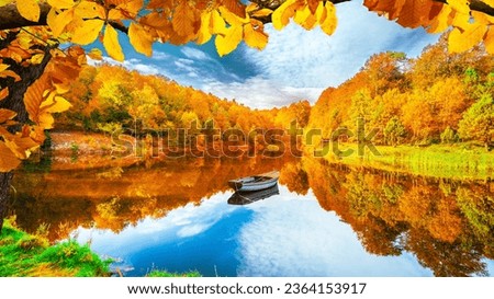 Autumn landscape at colorful lake with yellow leaf trees. Colorful trees and fall landscape in deep forest. Lake scenery of autumn in nature. reflection scene in lake landscape in beautiful nature.
