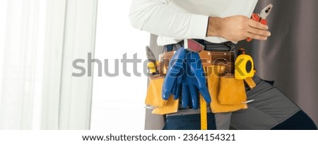 man and tools in leathern belt Royalty-Free Stock Photo #2364154321