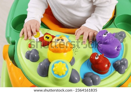 Little child in baby walker, closeup view
