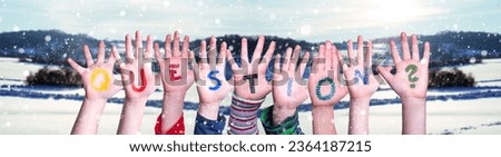 Children Hands Building Colorful English Word Question. White Snowy Winter Scenery And Landscape With Snowflakes As Background.