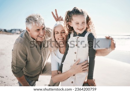 Family, selfie and beach holiday with peace sign, grandparents and young girl with a smile. Happy, child and love at the sea and ocean with a profile picture for social media on summer vacation