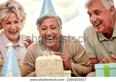 Senior woman, friends and birthday party and cake to blow candles, wish and celebration in nursing home. Elderly group, people and together for happy, event and laugh with diversity in retirement