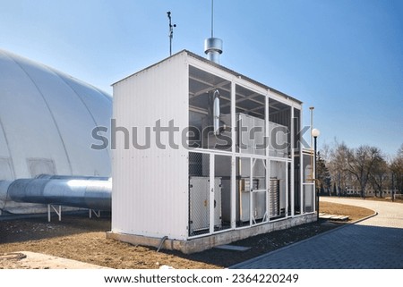 Inflatable air dome stadium. Inflated Football soccer air dome. Modern architecture example pneumatic stadium dome with natural gas heat generators, hot air blower and air conditioning system. Royalty-Free Stock Photo #2364220249