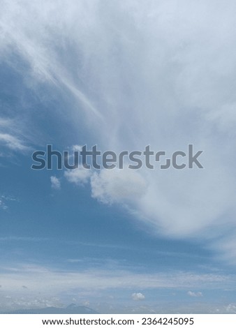 Summer blue sky and white clouds background. Beautiful clear cloudy in calm sunlight spring season. Cirrus vivid teal cyan cloudscape in environment. Outdoors horizon skyline fall spring sunshine day.
