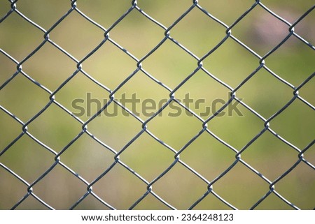 Stainless steel fencing wire. Garden wires are networks woven with steel cables. Terrace fence or railing isolated on blurred background. Safety equipment. Horizontal photo. No people, nobody.