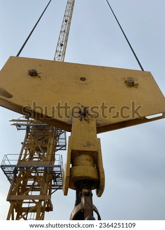 Yellow Hook Block Of Tower Crane Royalty-Free Stock Photo #2364251109