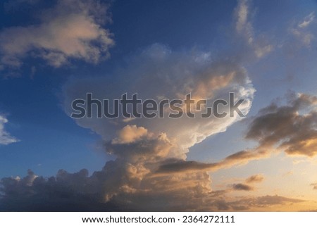 Thunderstorm clouds in the sky at sunset texture background overlay. Dramatic cumulonimbus image. High resolution photography perfect for sky replacement