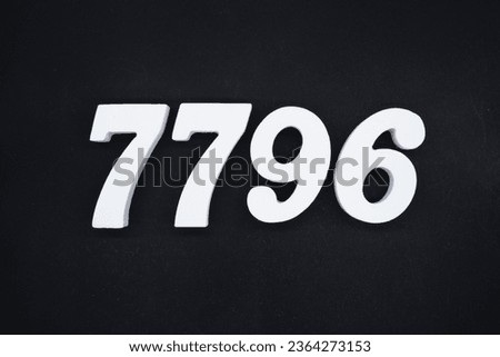 Black for the background. The number 7796 is made of white painted wood.