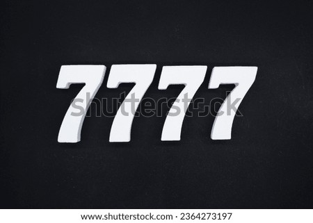Black for the background. The number 7777 is made of white painted wood.