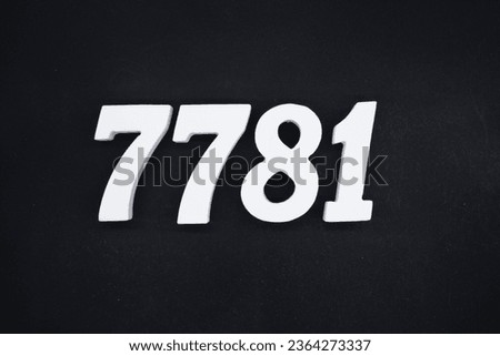 Black for the background. The number 7781 is made of white painted wood.