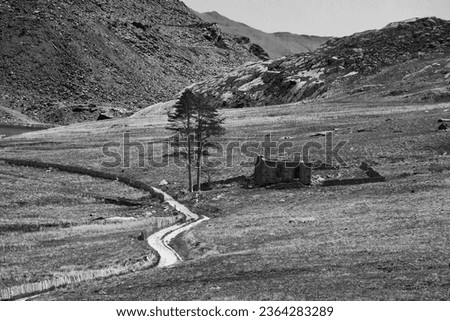 The ruins of the welsh methodist chapel being reclaimed by nature Cwmorthin Slate Quarry in North Wales Royalty-Free Stock Photo #2364283289