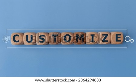 Customize word and tools icons on wood block. customize word is made of wooden building blocks lying customize, business concept, on a blue background