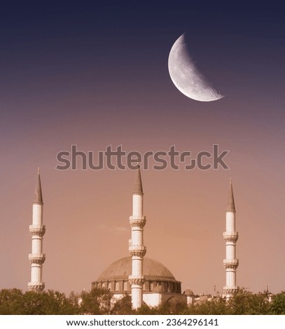 Mosque front view. Bright moon over the mosque at beautiful sunset. Background for celebrating Islamic days. Mosque picture.