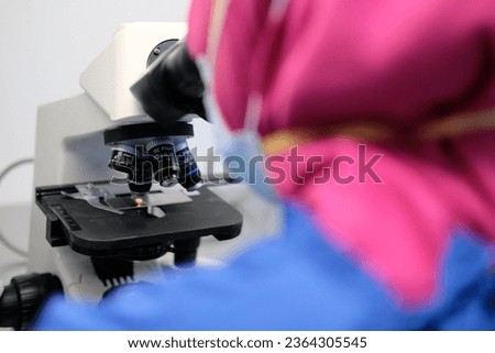 Scientist with Microscope Technology at Hospital Laboratory Royalty-Free Stock Photo #2364305545