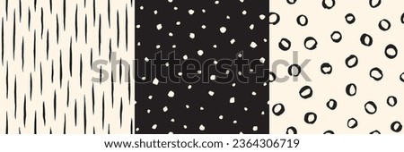 Hand drawn black and white doodle seamless patterns set - circles, rings, fusiform brush drawn strokes, smears, ink lines, stripes, uneven dots, specks, flecks. Chaotic creative artistic backgrounds.