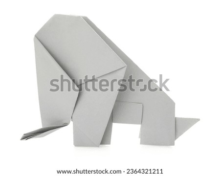 Creative origami elephant on white background