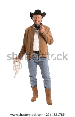 Mature cowboy with lasso on white background