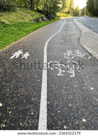 Pedestrian and cyclist road signs on the road Royalty-Free Stock Photo #2364322179