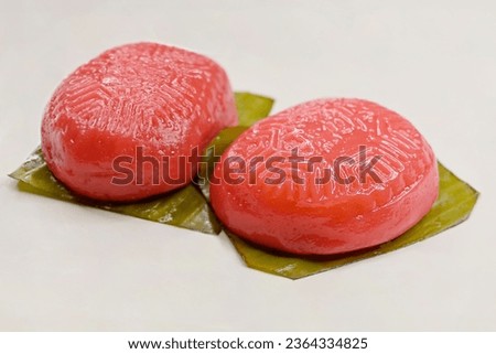 Tortoise Cakes or 'Ang Ku Kueh', a traditional Chinese pastry, with glutinous rice flour skin, steamed on banana leaf Royalty-Free Stock Photo #2364334825