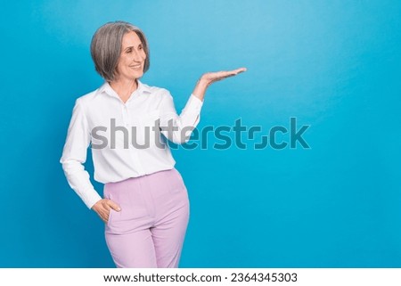 Photo of elegant classy person look arm palm hold demonstrate empty space proposition isolated on blue color background