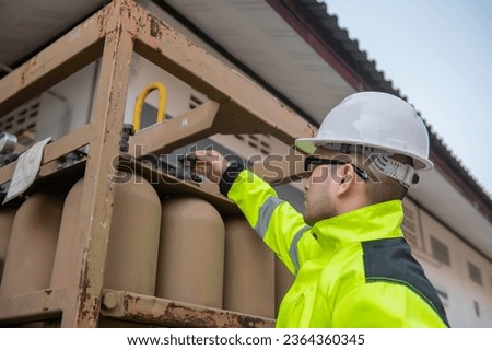 Engineers work place to keep liquid helium,preventive maintenance schedule checking,Thailand people Royalty-Free Stock Photo #2364360345