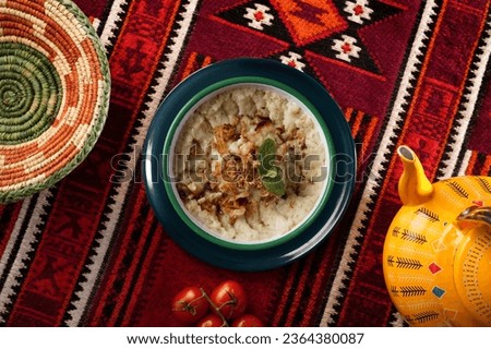 traditional saudi arabia food, groats its called in arabic jareesh, marquq,saleeg.
traditional plate in central region najd. Royalty-Free Stock Photo #2364380087