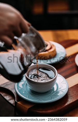 Capturing the cozy cafe vibe, our photos showcase perfectly brewed coffee and delightful coffee drinks. Each image exudes warmth and flavor in every sip.