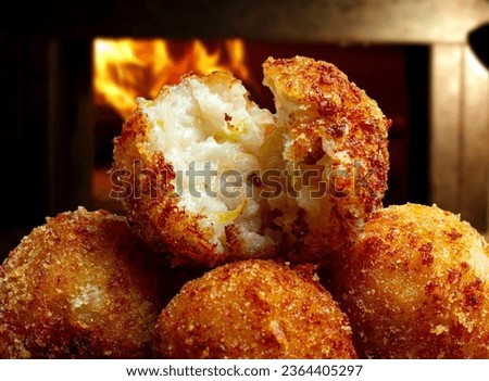 Fried rice balls. Traditional from Brazil where it is called Bolinho de arroz. Royalty-Free Stock Photo #2364405297
