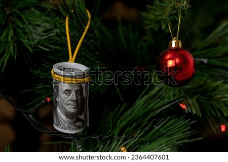 money on the Christmas tree in the form of a Christmas tree toy