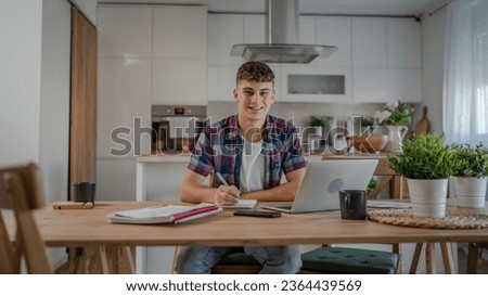 Young caucasian man teenager student study at home Royalty-Free Stock Photo #2364439569