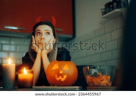 
Sad Woman Feeling Alone During Halloween Celebration Events
Depressed bored girl waiting at home for holidays to pass 
