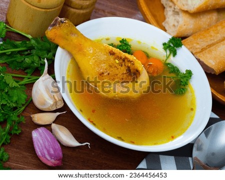 Image of tasty scottish traditional soup cock-a-leekie with chicken, bacon and leek Royalty-Free Stock Photo #2364456453