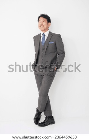 Portrait of Asian middle aged businessman in white background