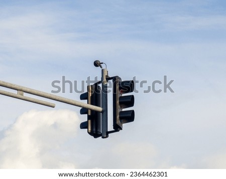 Traffic light above the road against the sky. Road traffic concept. Prohibited traffic light signal. Traffic light camera