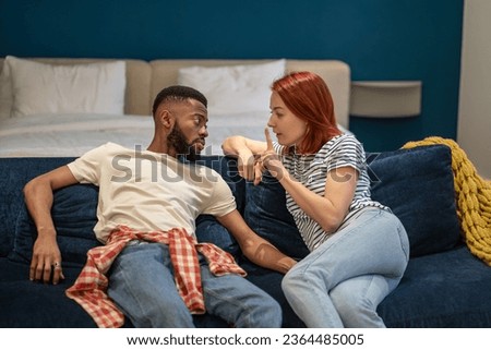 African american man caucasian woman discussing problems in relationships. Husband attentively listening wife explaining difficulties gesturing hands. Misunderstanding, attempt to resolve conflict. Royalty-Free Stock Photo #2364485005