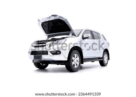 isolated simple and metallic suv car on white background front view with the open hood Royalty-Free Stock Photo #2364491339