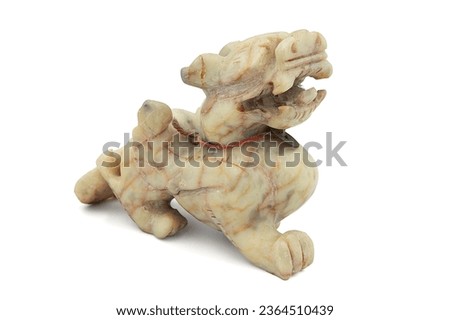 Pixiu are a Chinese lucky animal isolated on white background. Jade stone Pixiu Dragon Feng Shui sculptures.