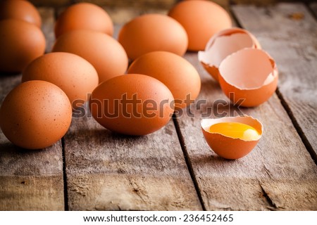 Fresh farm eggs on a wooden rustic background Royalty-Free Stock Photo #236452465