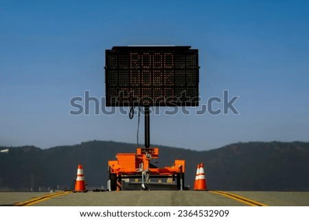 Horizontal image of a Digital Road Sign stating Road Work Ahead