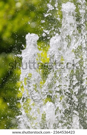 Splashes of water in a fountain in summer.