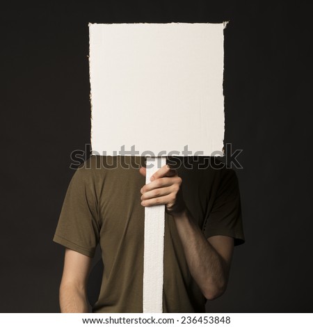 Faceless person holding a blank square sign